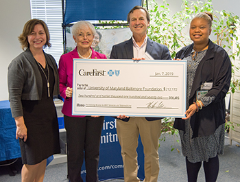 Dr. Weintraub is presented with check from CareFirst