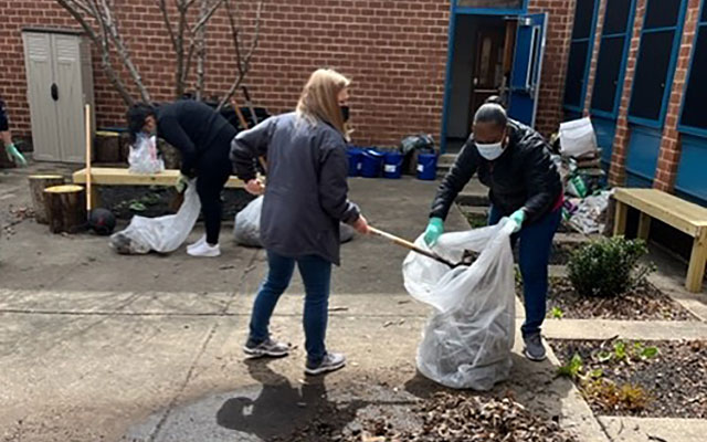 Students cleaning the grounds