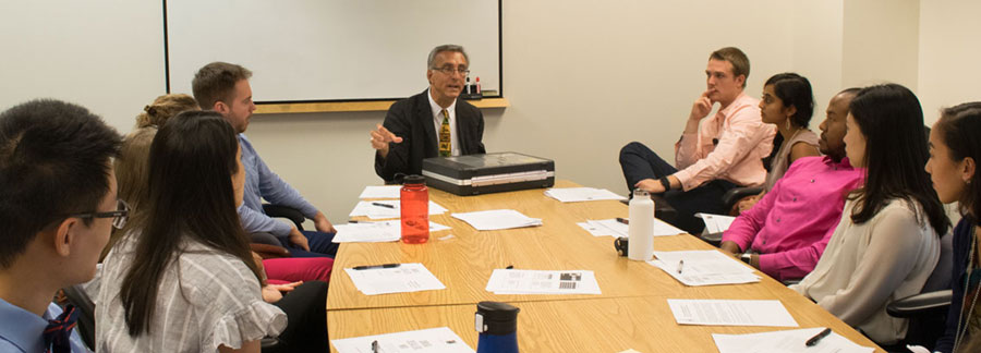 Dr. Welsh and researchers in a meeting