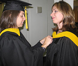 Two Graduates shaking hands