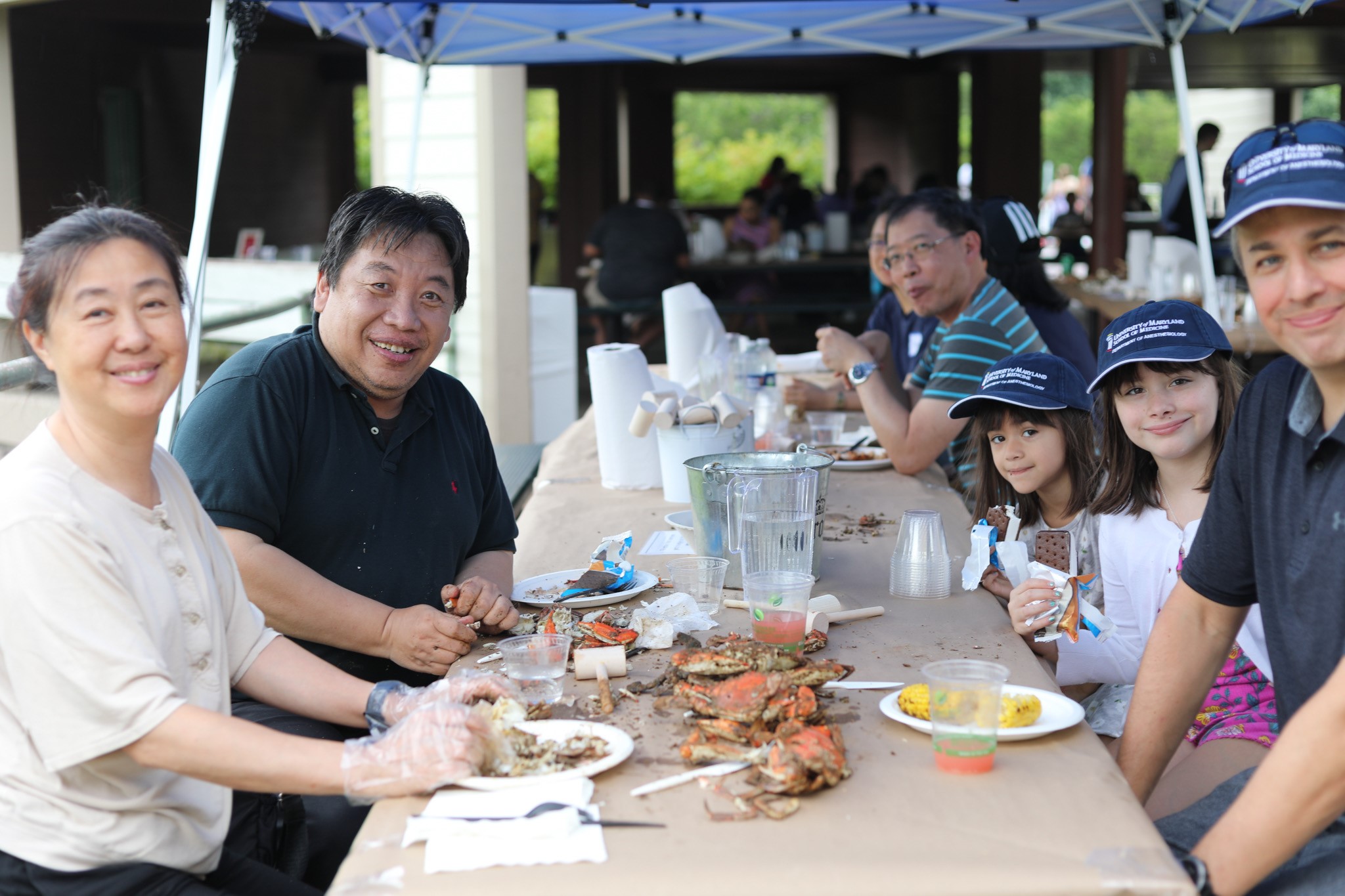 Families enjoying crabs and other goodies