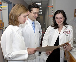 Students in classroom with lab coats