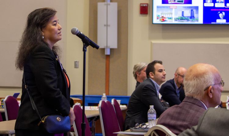 Photo of Dr. Chang at microphone