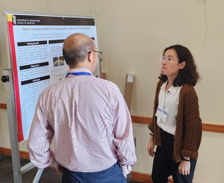 Photo of a woman presenting a poster