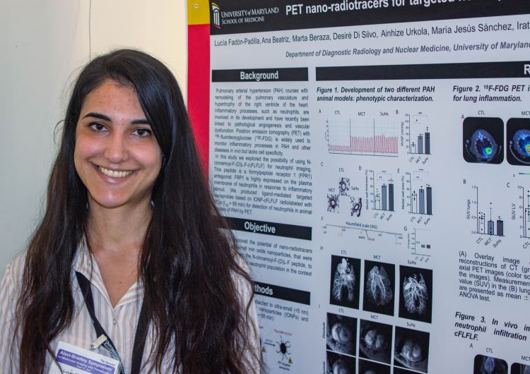 Photo of a woman presenting a poster