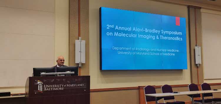 Photo of Dr. Melhem at symposium