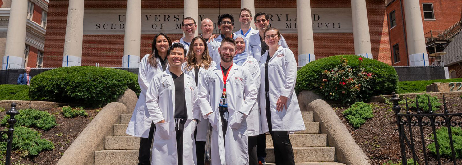 Group photo of EM graduates outside of Davidge Hall