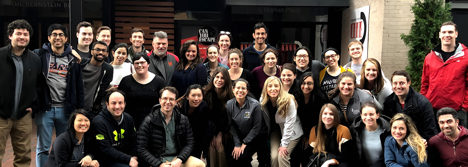 Group shot of emergency medicine students in front of building