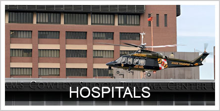 Text: Hospitals Background Photo: Helicopter at Shock Trauma Center
