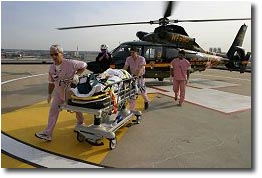 Picture of a patient being transported off of an emergency helicopter