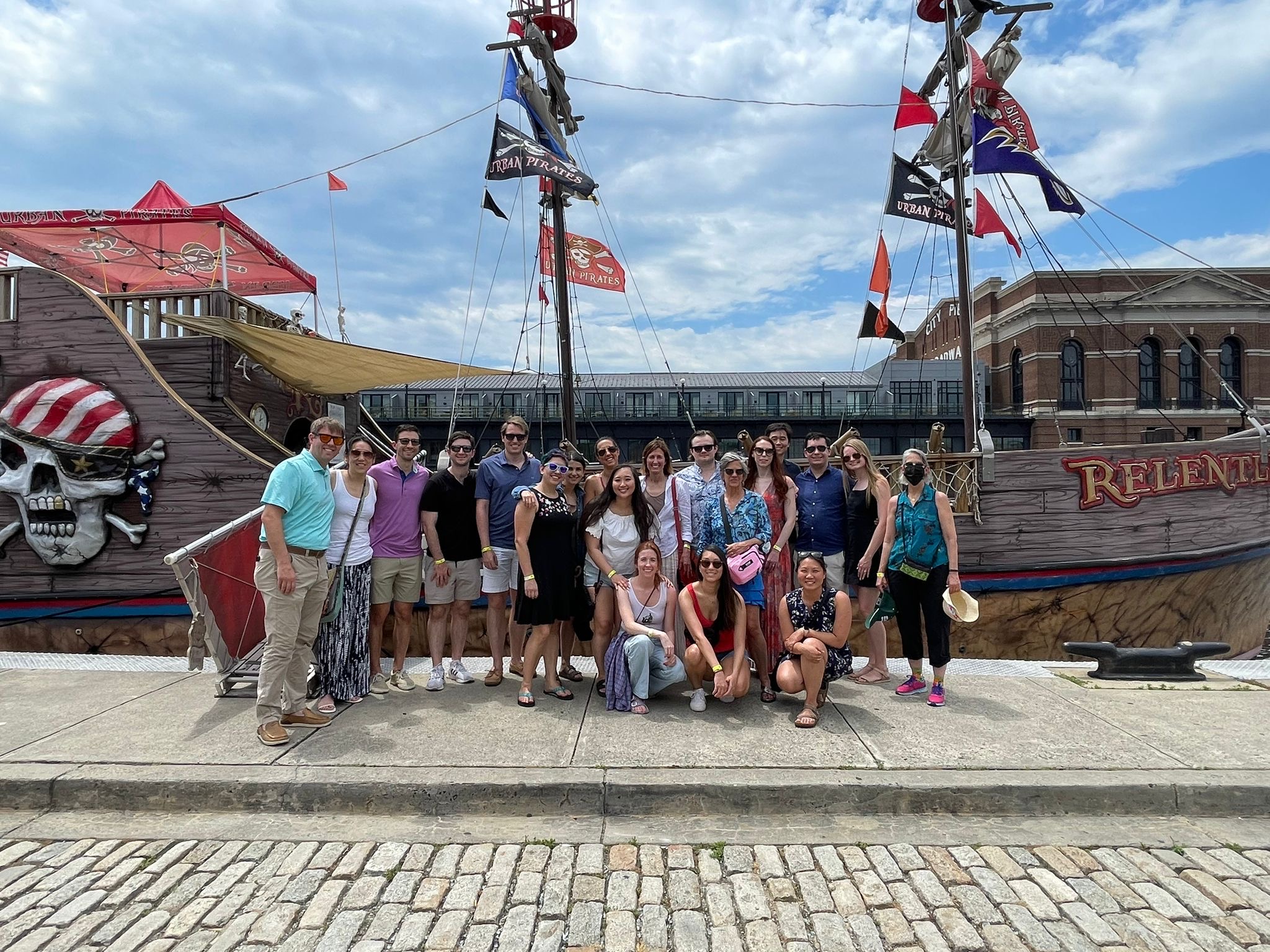 Residents posing in front of a ship
