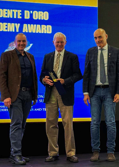 Stephen Thom, MD, with associates in Italy receiving the Golden Trident Award