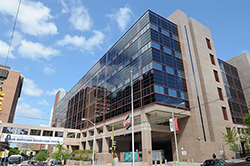 Photo of the Baltimore VA Medical Center in downtown Baltimore, including a pedestrian bridge across the city street