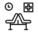 Hospital chairs with a clock and emergency sign