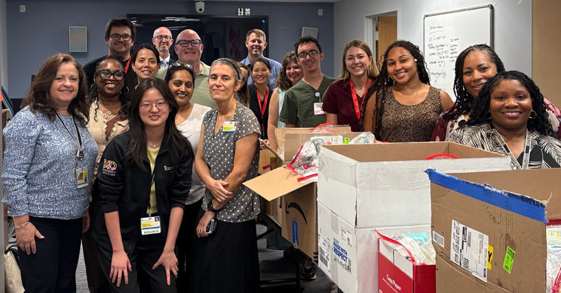 Department faculty, staff, and residents posed at a community service event