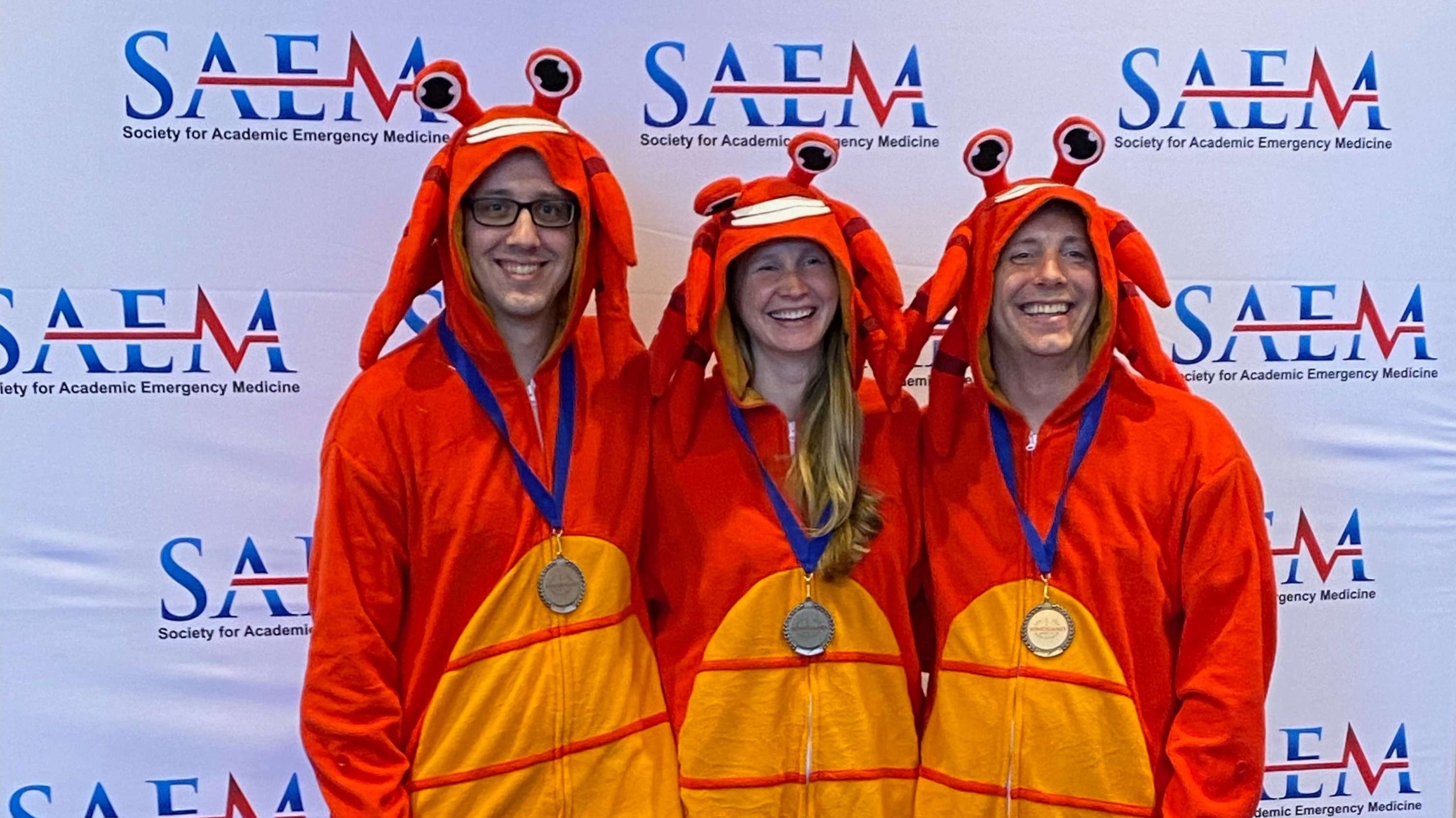 Picture of physicians in the Ultrasound program dressed like lobsters for a fun activity
