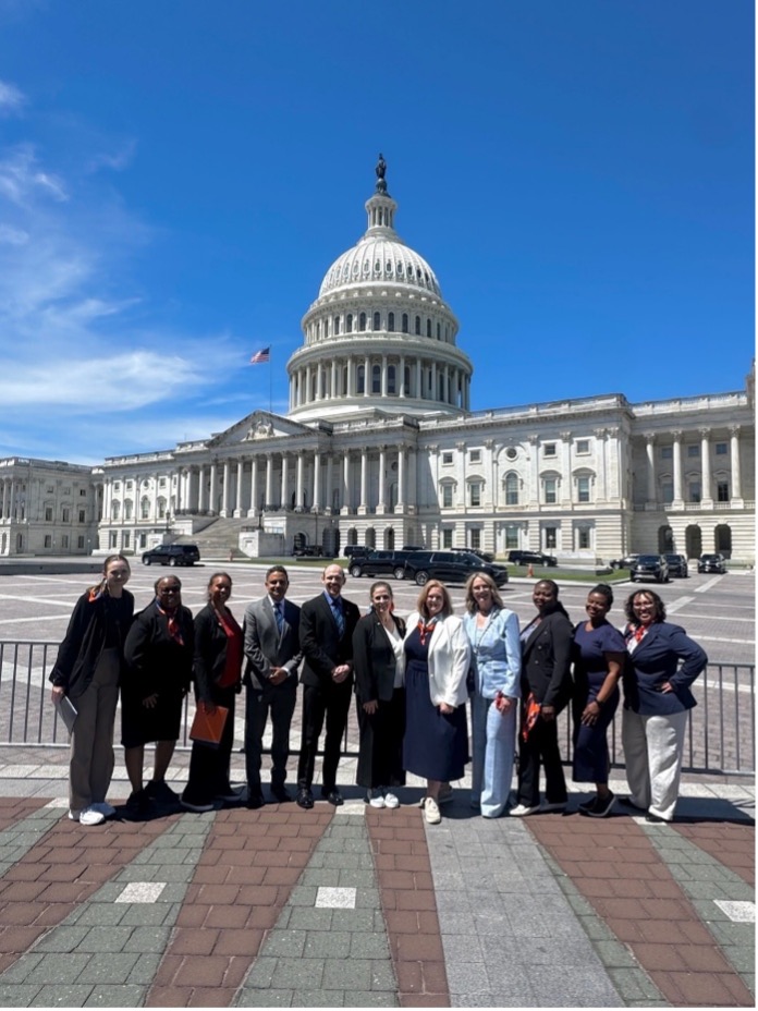 Group poses outside Capitol building