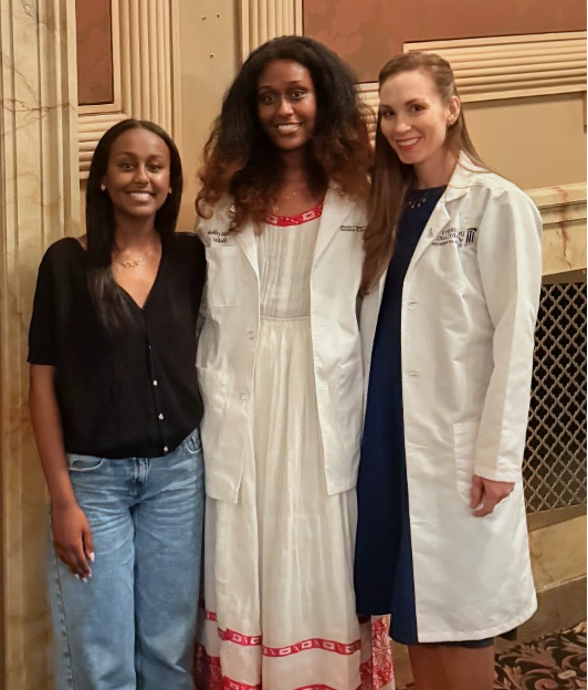 Eden Tewodros poses with Dr. Marissa Khajavi and another person