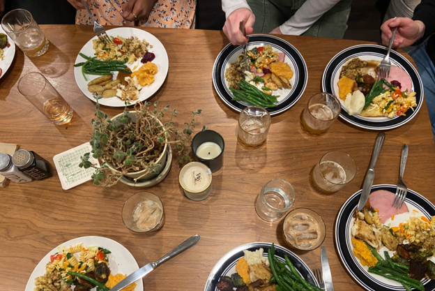 Bird's-eye view of a dinner table with several plates of different foods