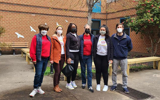 Group photo of students volunteering at James McHenry School