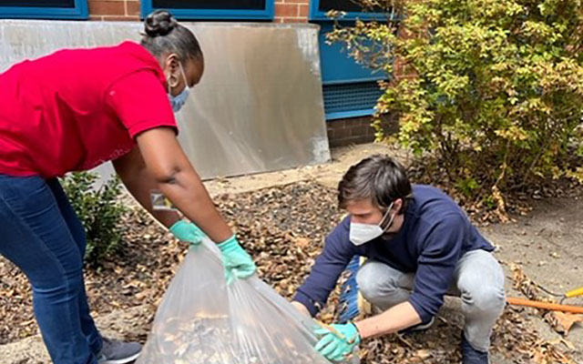 Students cleaning the grounds