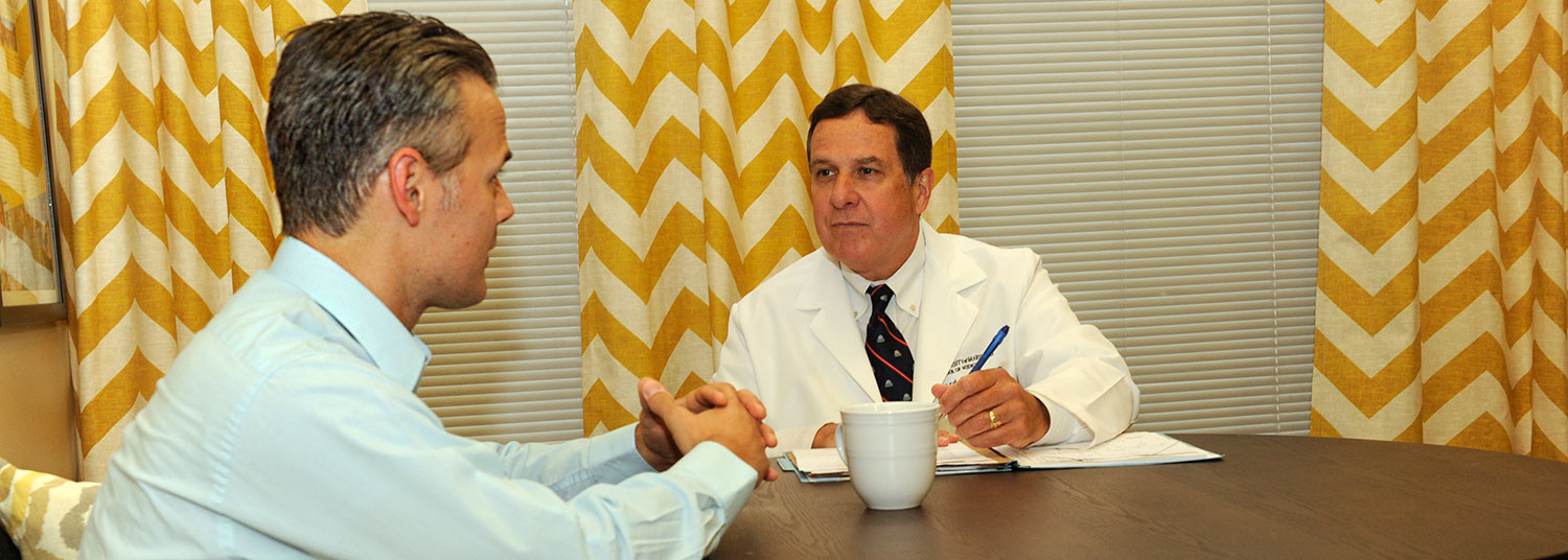 Doctor consulting with patient