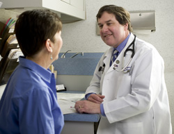 Dr. Colgan consulting with a patient