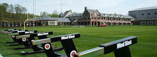 Football sleds on practice field