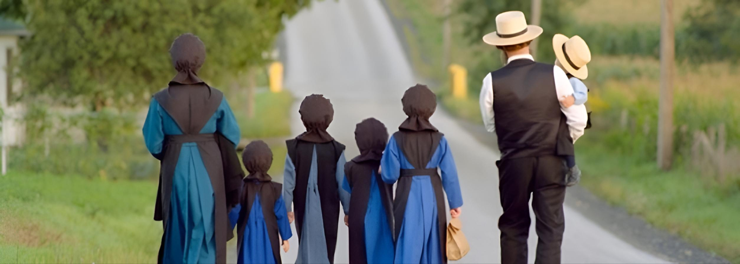 Amish family walking down the road