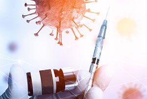 Hand with glove holding a needle