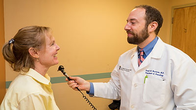 Daniel Harrison, MD With Patient