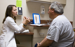 Doctor listening to patient