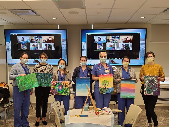 Doctors Holding Painting they have done