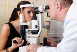 Female having eyes examined