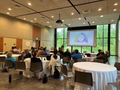 Faculty member shares a presentation with the group during the retreat.