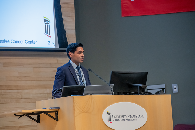 Mark Mishra presenting at UMGCCC Research Day 2025