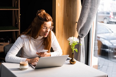 Girl at laptop (Shutterstock)