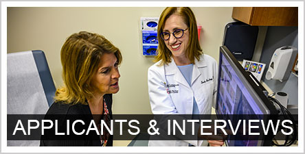 Applicants and Interviews text over a photo of a faculty and student