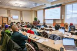 Shilpa Dilip Kumar presents on image analysis methods to a room full of attendees