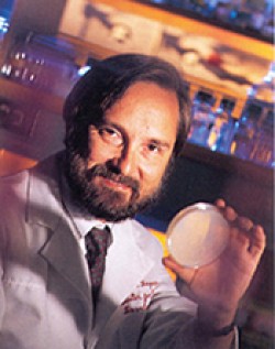 Dr. James Kaper holding a Petri dish