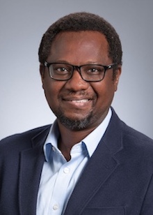 man in glasses and dark suit