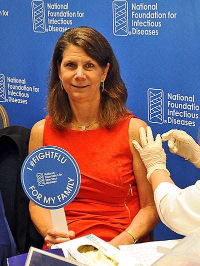 Dr. Kathy Neuzil getting vaccinated