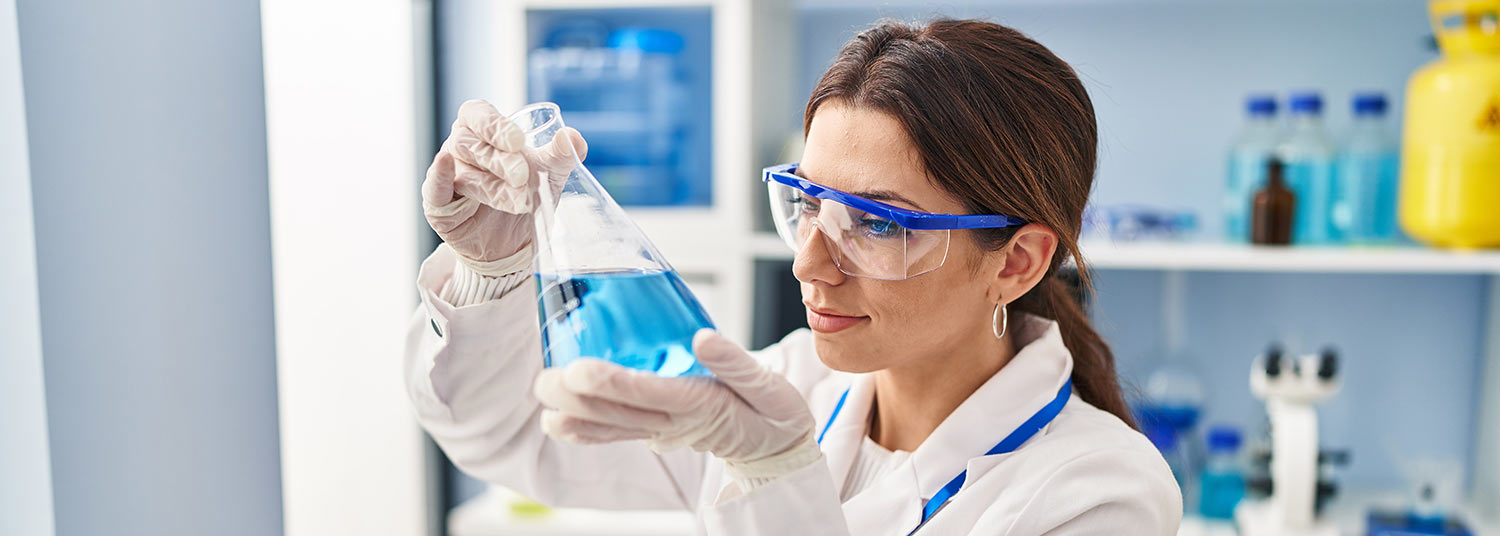 Female science researcher with beaker