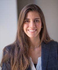 Photo of Dr. Angela C.B. Trude in a navy blazer with white top underneath