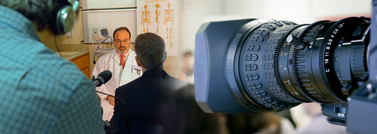 Faculty being filmed for a video