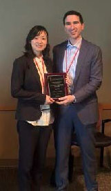 Dr. Hanna presenting an award to Dr. Liu