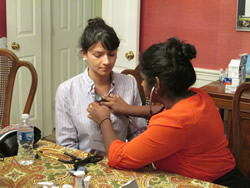 Student practicing with stethoscope