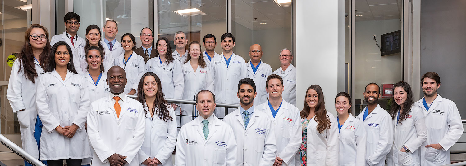 Group photo of faculty banner