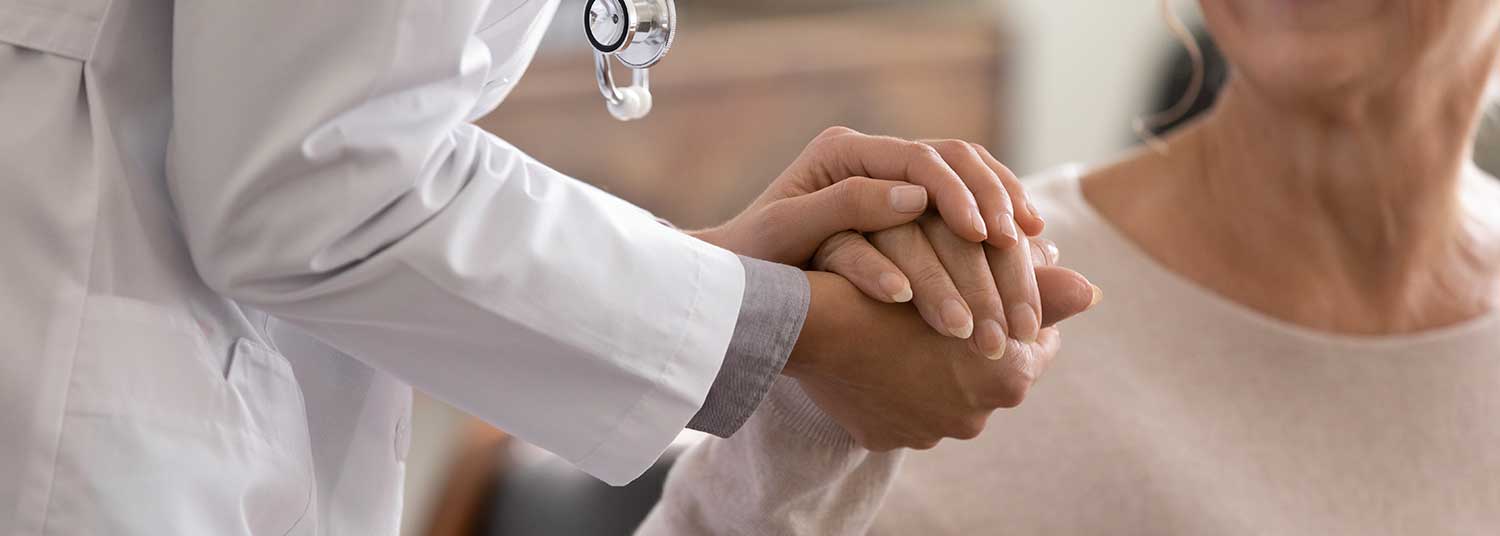 Caregiver comforting a patient